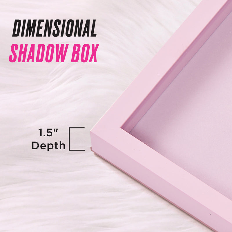 Showcased on a white fur surface, the Shadow Box Wall Art, 18″ x 24″, features a chic pink frame with a 1.5-inch depth. The text “Dimensional Shadow Box” and “1.5 Depth” highlight its stylish design—perfect for displaying fashion-inspired artwork or adding a touch of Juicy Couture flair to your space.