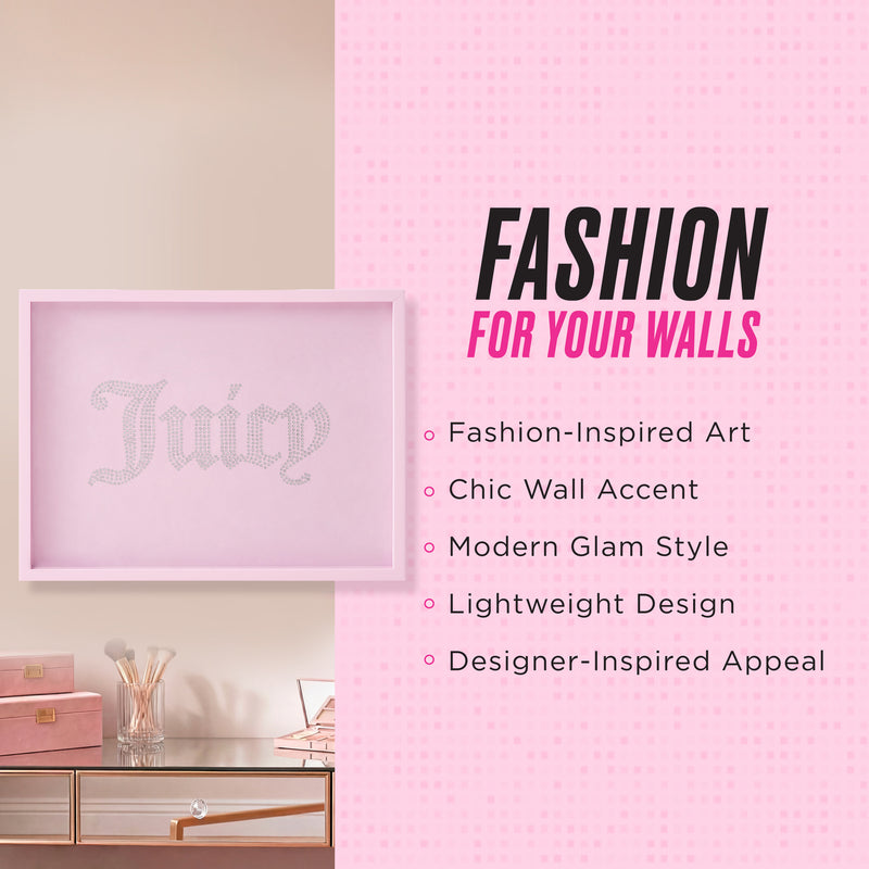 An 18″ x 24″ Shadow Box Wall Art with a pink frame and rhinestone “Juicy” text hangs on a soft pink wall above a desk adorned with makeup items. This piece, inspired by Juicy Couture, is promoted as fashion-forward, chic, modern, lightweight, and designer-inspired.