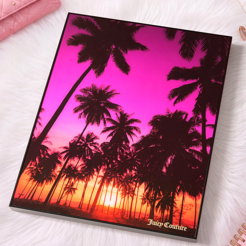 Add a chic touch to your space with the Shadow Box Wall Art, 18″ x 24″—a fashion-inspired piece depicting palm trees silhouetted against a vivid pink and orange sunset sky. Featuring “Juicy Couture” in gold text at the bottom and beautifully framed on a white fluffy surface, this striking Juicy Couture wall art brings sophisticated style to any room.