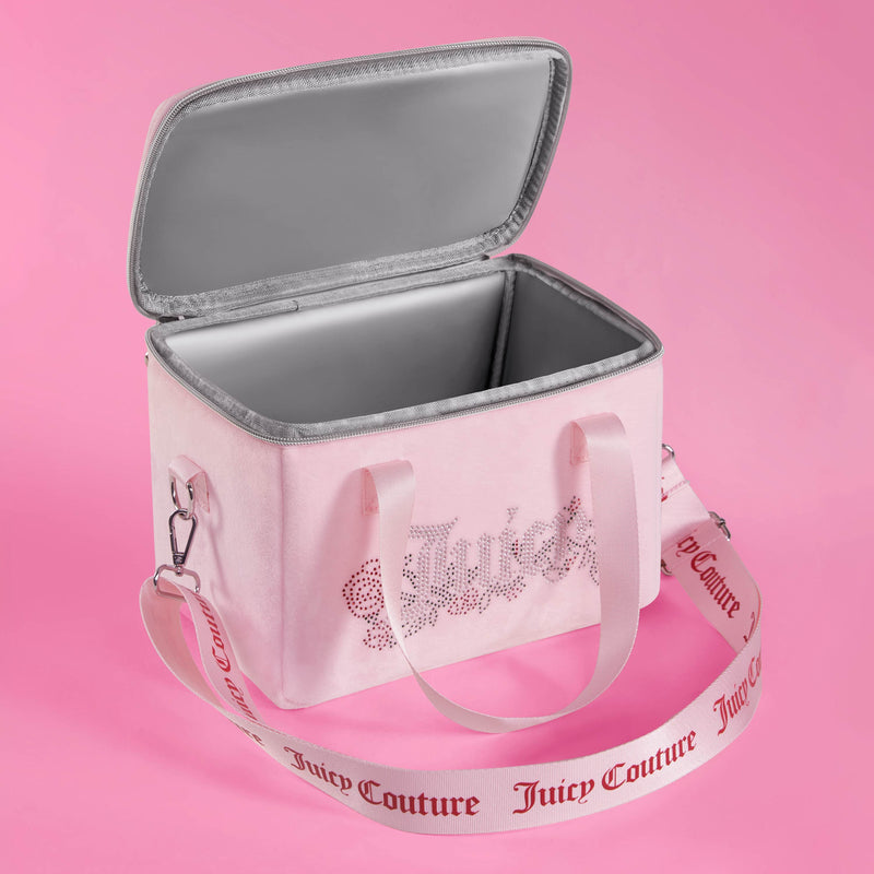 A pink Chill Couture Cooler Bag with an open lid reveals a silver insulated interior. This stylish lunch tote features a detachable white shoulder strap adorned with “Juicy Couture” written in pink. The insulated cooler bag is displayed against a pink background.