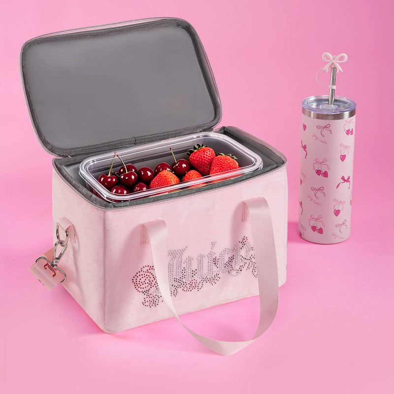 The Chill Couture Cooler Bag, in a soft pink hue and adorned with a charming cherry and strawberry design, sits next to a matching pink tumbler featuring a cherry motif and a bow on the straw—perfectly styled against a pink background. This insulated cooler bag is both chic and practical, ideal for keeping your treats fresh while elevating your everyday look.
