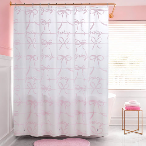 A pink and white bathroom features a PEVA Shower Curtain Liner on a gold rod. Pink towels sit on a small table beside a round pink rug, adding soft color accents to the space.