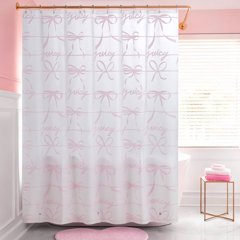 A pink and white bathroom features a PEVA Shower Curtain Liner on a gold rod. Pink towels sit on a small table beside a round pink rug, adding soft color accents to the space.
