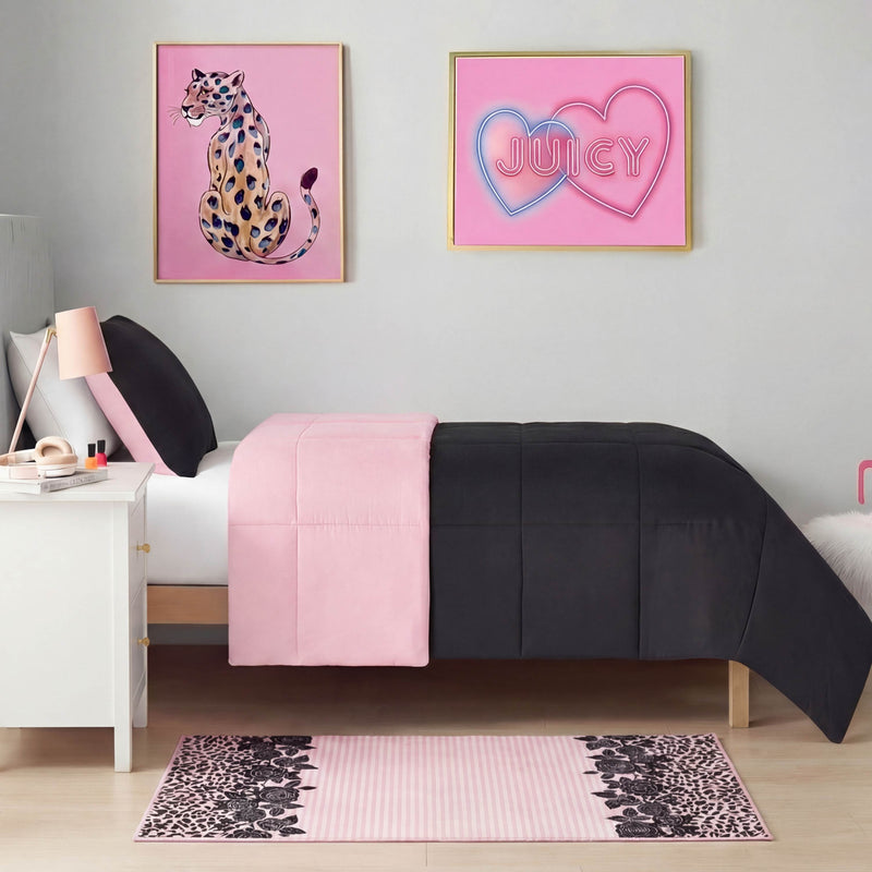 A modern bedroom with a twin bed and black and pink comforter, a white nightstand with lamp, pink wall art, and a Finely Washable Rug (2' x 4') featuring leopard print brings extra style and comfort to the floor.