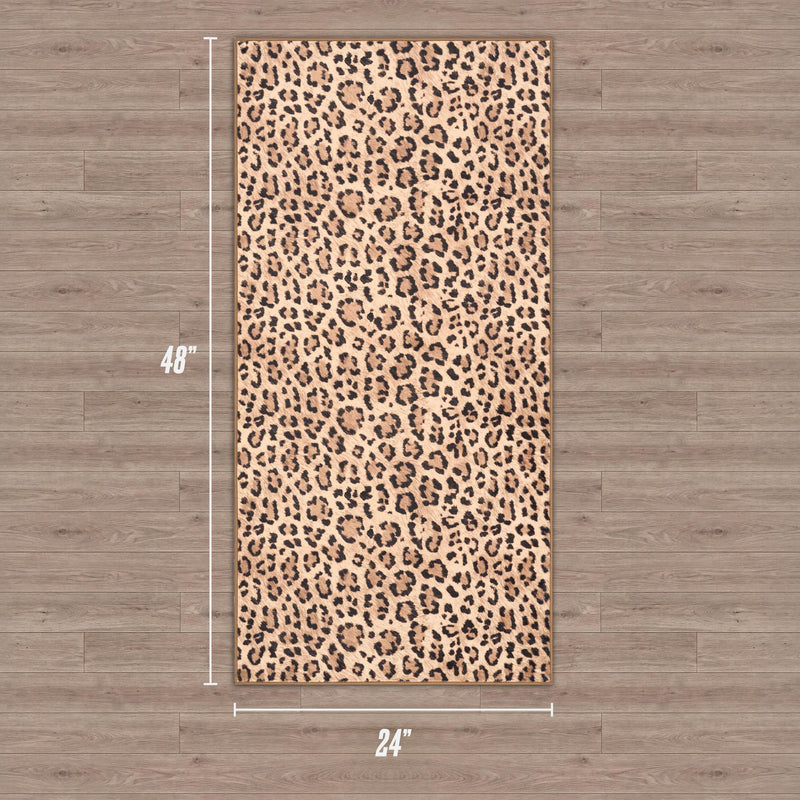 Finely Washable Rug, 2' x 4', features a rectangular ultra-soft design with a leopard print pattern, shown on a wood floor. Dimensions: 48" long by 24" wide.