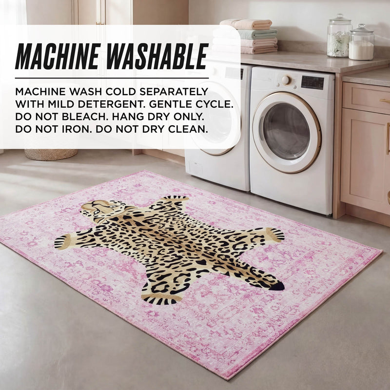 A laundry room with a front-loading washer and dryer, the Finely Washable Rug (3' x 5') with a leopard design, folded towels, and a plant. Text overlay displays machine washing instructions for the rug.