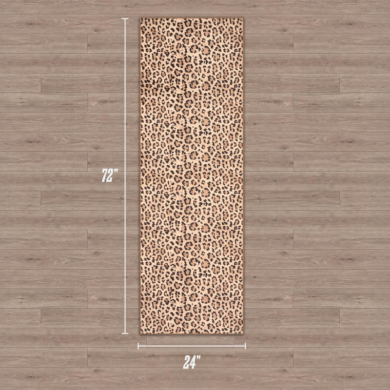 Finely Washable Rug, 2' x 6', featuring a brown and black leopard print pattern, adds style and comfort to your workout space when placed on a light wood floor. Perfect for yoga or exercise routines.
