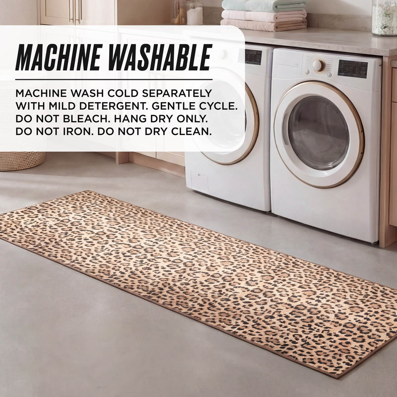 A laundry room features a Finely Washable Rug, 2' x 6', with leopard print in front of the washer and dryer. Sign: Machine wash cold separately with mild detergent, gentle cycle. Hang dry only. Do not iron or dry clean.