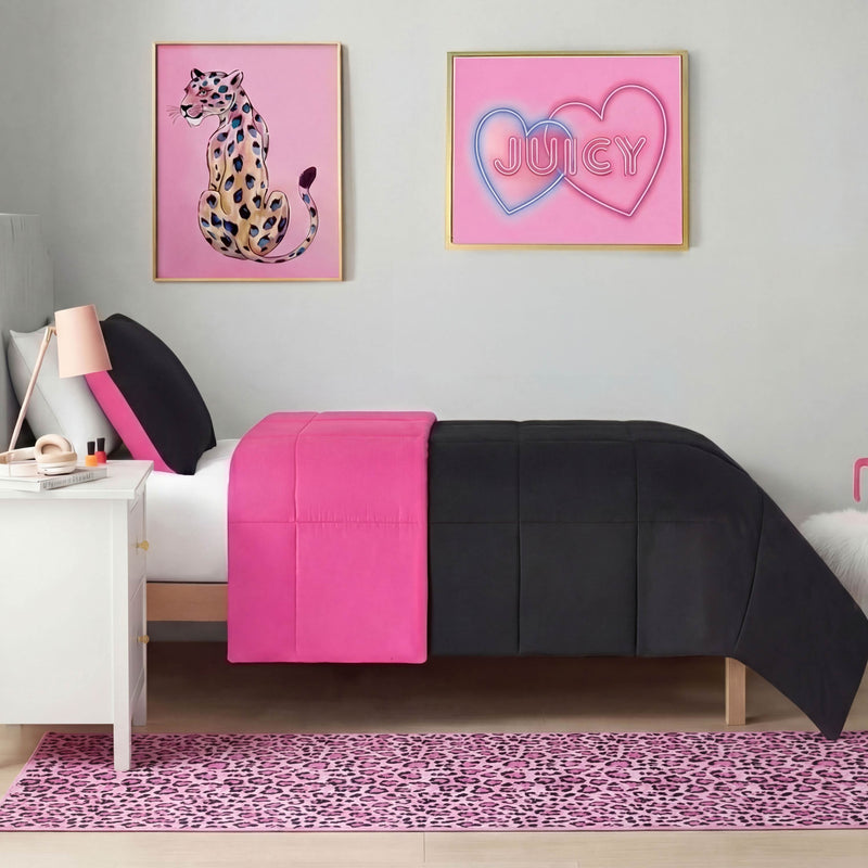 A stylish bedroom features a twin bed with bright pink and black bedding, a white nightstand, wall art, and a Finely Washable Rug (2' x 6') in leopard print running alongside the bed.