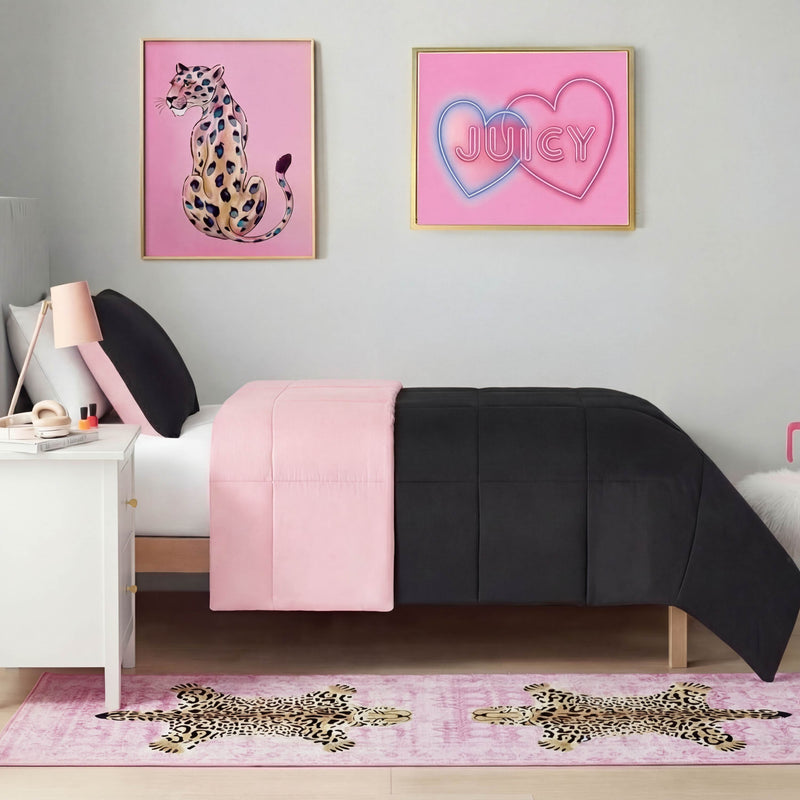 A stylish bedroom features a bed with black and pink bedding, a white nightstand, and JUICY neon heart and leopard wall art. A Finely Washable Rug, 2' x 6', with leopard designs adds flair to the floor.