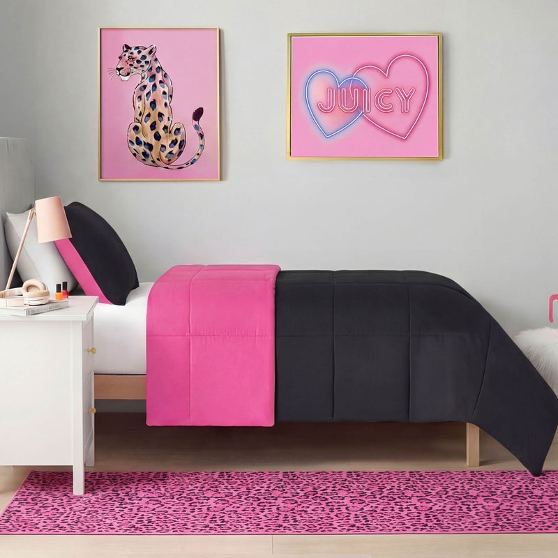 A modern bedroom includes a bed with black and hot pink bedding, a white nightstand, and a Finely Washable Rug (2' x 6') in pink leopard print. Above the bed are two framed art pieces: a cheetah illustration and JUICY inside heart outlines.