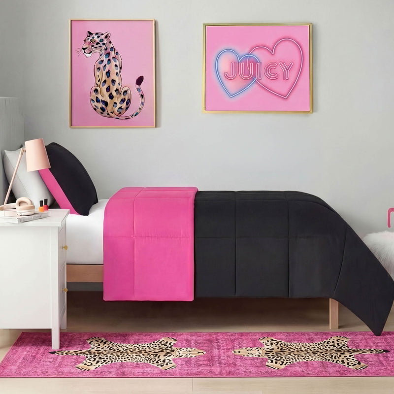 A modern bedroom with a black and hot pink bed, white nightstand, pink decor, cheetah and "Juicy" heart wall art is completed by the Finely Washable Rug, 2' x 6', featuring cheetah designs for ultra-soft, easy-care comfort.