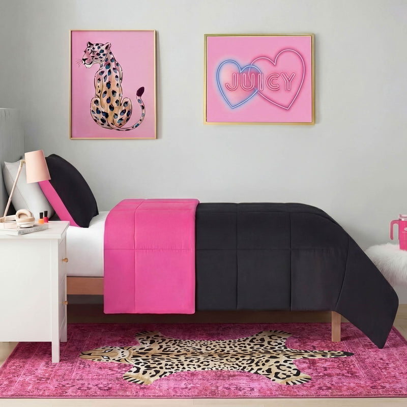 A neatly made bed with black and hot pink bedding sits against a gray wall, beneath framed art featuring a cheetah and pink neon JUICY hearts. The chic look is finished with the Finely Washable Rug, 5' x 7', which is ultra-soft and easy to clean.
