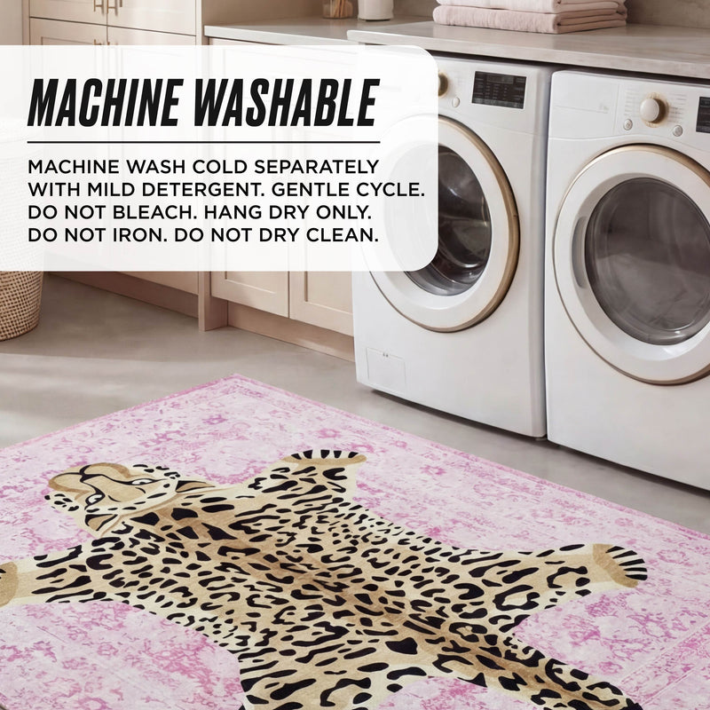 A laundry room with a washer and dryer, featuring the ultra-soft Finely Washable Rug, 7'10 x 10', in pink leopard design. Machine washable: wash cold separately with mild detergent, gentle cycle; do not bleach, hang dry only, do not iron.