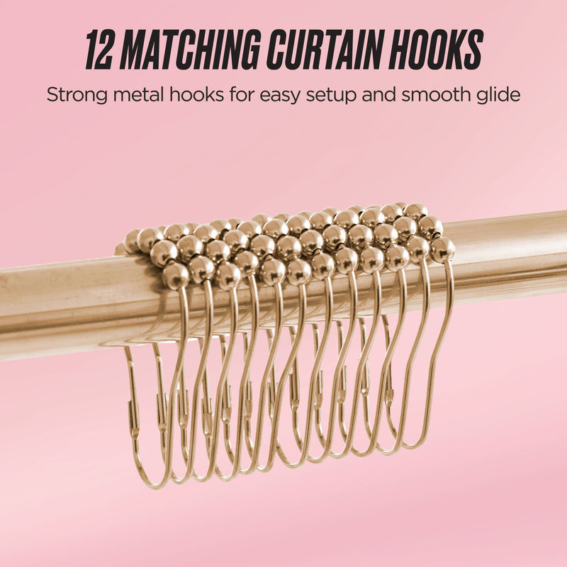 The Shower Curtain and Hooks Set includes 12 matching gold metal hooks lined up on a rod against a pink backdrop, ideal for enhancing your bathroom decor. Text above: “12 matching curtain hooks. Strong metal hooks for easy setup and smooth glide.”.