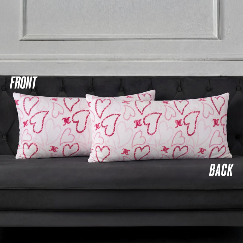 Three rectangular white pillows with pink and red hearts, including a Plush Body Pillow, are arranged on a dark gray tufted sofa. Labels FRONT and BACK indicate the pillow positions.