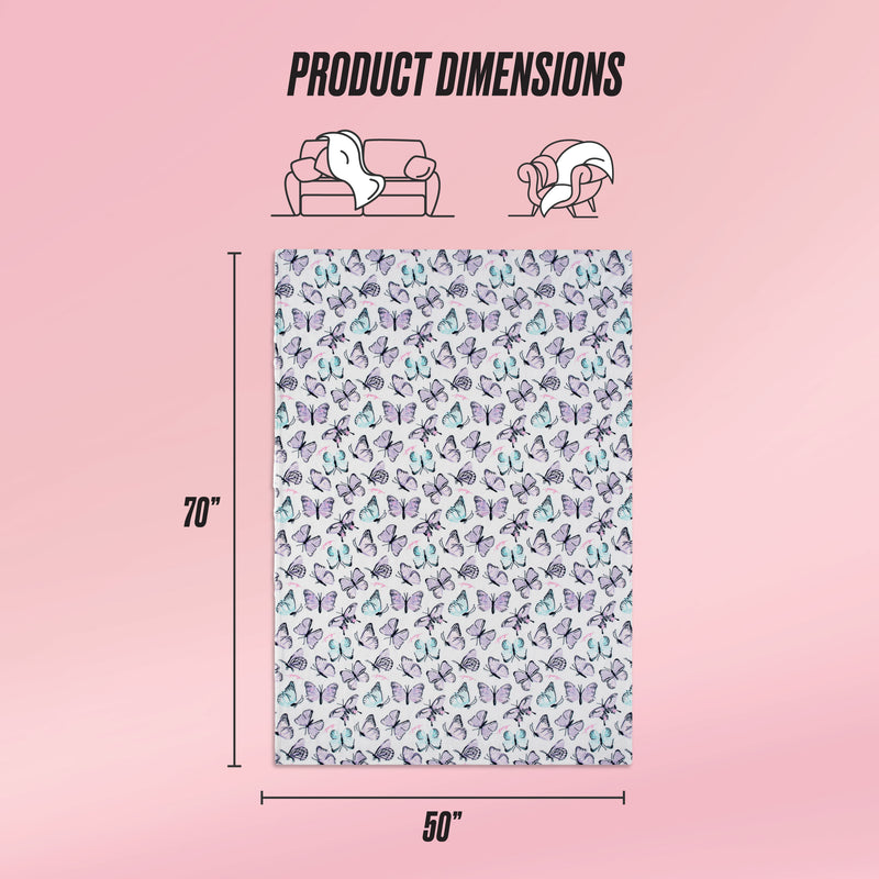 A Kids Plush Throw Blanket with a pastel butterfly pattern is displayed on a pink background. Text above says Product Dimensions. The blanket measures 70 x 50 inches, shown with scale icons of a couch and person.