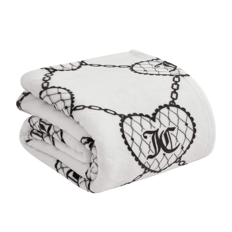 The Plush Oversized Throw Blanket features an ultra-soft fabric with a black chain and heart pattern. Each heart has a net-like design with a stylized "J," giving this Juicy Couture blanket a cozy and fashionable touch.