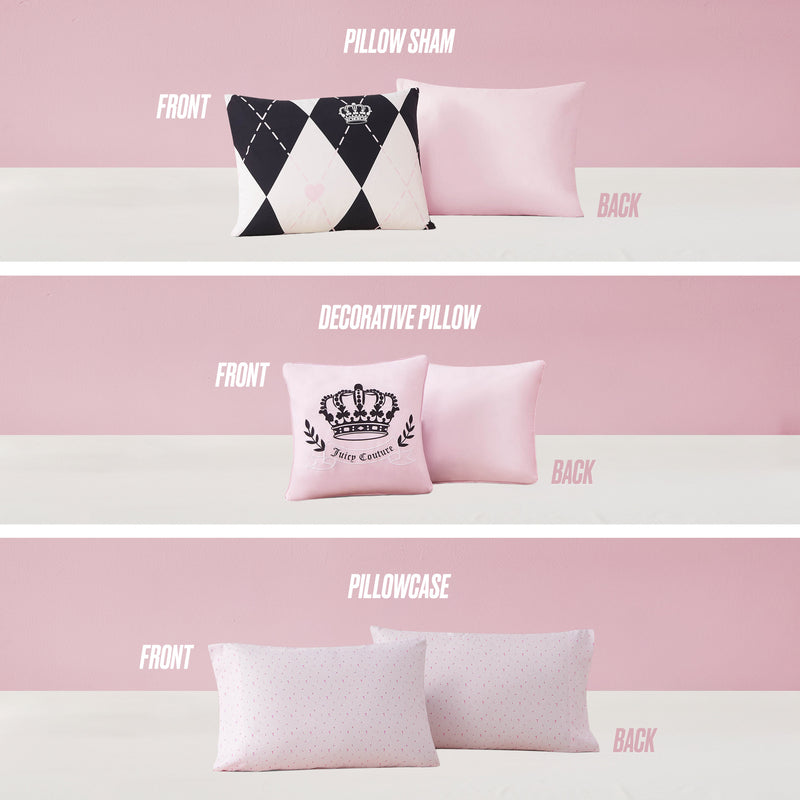 Three pillows on a pink background coordinate with the Royal Argyle Reversible Bed in a Bag Set: a black and pink argyle Juicy Couture pillow sham with crown, a pink pillow with crown design, and a dotted pink pillowcase.