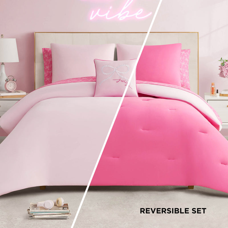 A designer-inspired bedroom features the Pearly Bows Reversible Bed in a Bag Bedding Set with a light and hot pink comforter, accented by decorative pillows and a neon vibe sign for added flair in the soft pink and white space.