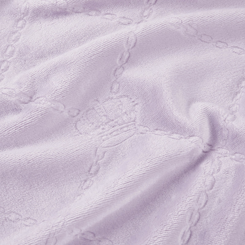 Light purple textured fabric with embossed crowns and chain-like grid lines creates a soft, cozy Plush Oversized Throw Blanket, 60" x 90". Perfect for adding Juicy Couture-inspired elegance to any twin bed.