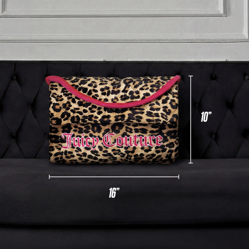 The Purse Decorative Pillow, featuring a leopard print with pink trim and logo, measures 16" x 10" and is shown on a black tufted sofa against a white panel backdrop—a chic accent for any room.