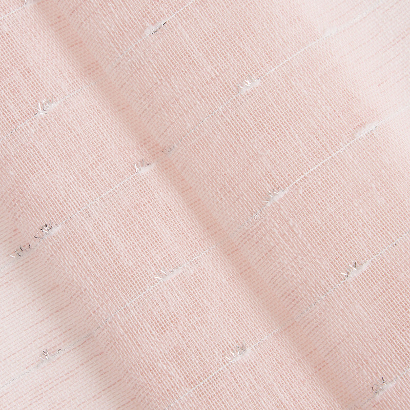 Close-up of soft, pale pink fabric with woven texture and subtle silver threads; the Aurora Sheer Window Curtain adds elegance and shimmer to any space.