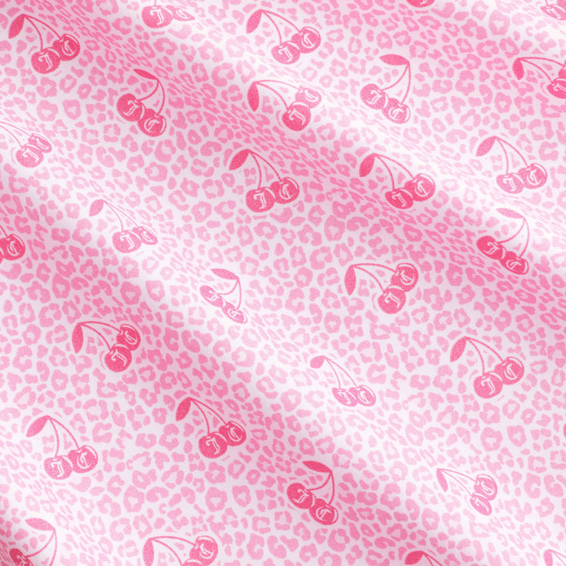 Bring a playful yet sophisticated touch to your bedroom with the Microfiber Sheet Set With Extra Pillowcases, featuring soft pink fabric adorned with a light pink leopard print and darker pink cherry illustrations arranged in a repeating diagonal pattern across the surface.
