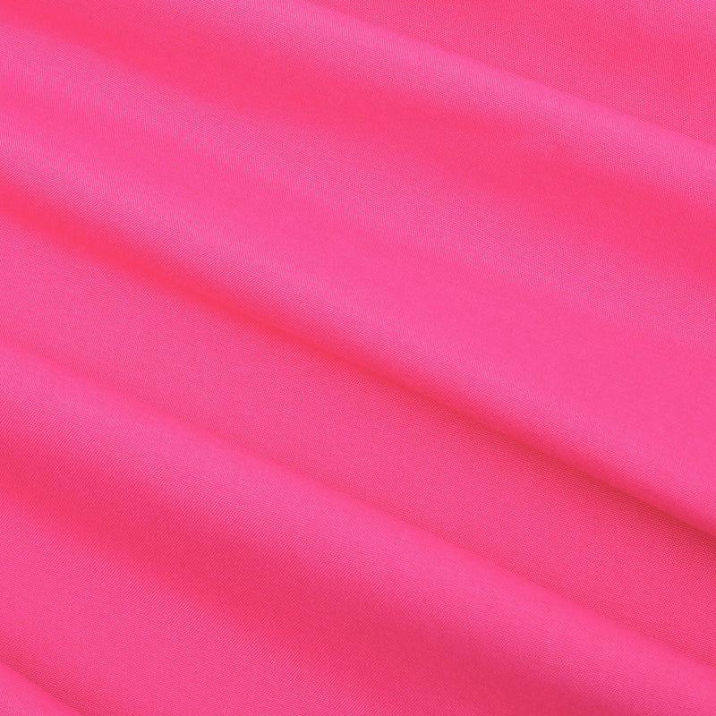 Experience the luxurious feel of our Microfiber Sheet Set With Extra Pillowcases, featuring bright pink fabric adorned with soft folds running diagonally across the surface—creating gentle shadows and a smooth texture reminiscent of luxury bedding.