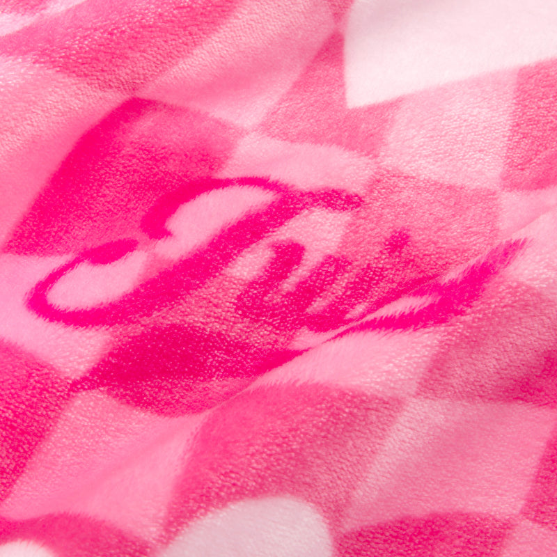 Cuddle up in the Plush Oversized Throw Blanket, 60″ x 70″, featuring a soft pink checkered fleece design with “Twist” elegantly scripted in darker pink cursive, partially hidden by the fabric’s gentle folds—perfect for adding cozy comfort and chic style to any room.