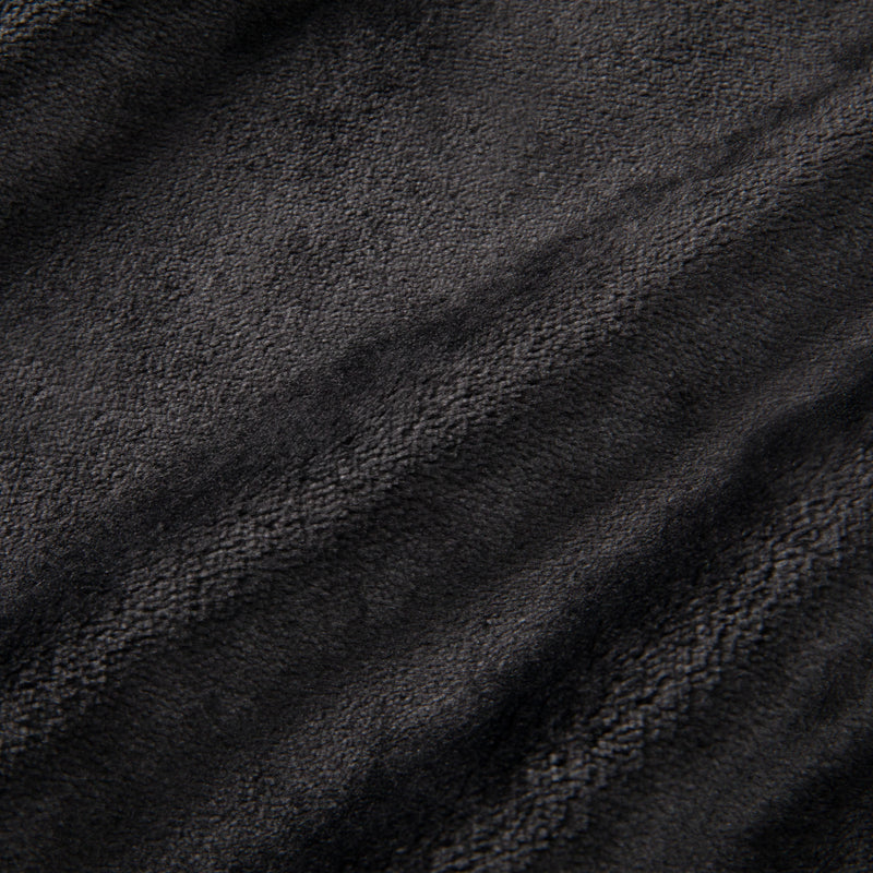 Close-up of a soft, dark gray textured fabric with subtle wavy lines and a slightly fuzzy, plush surface—perfectly capturing the luxurious feel of the Plush Oversized Throw Blanket, 60″ x 70″.