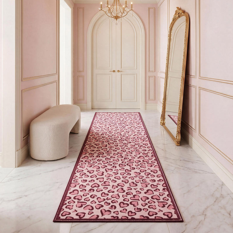 Finley Washable Rug, 2′ x 6′ ultra-soft runner rug with a pink and burgundy heart pattern centered in a hallway.