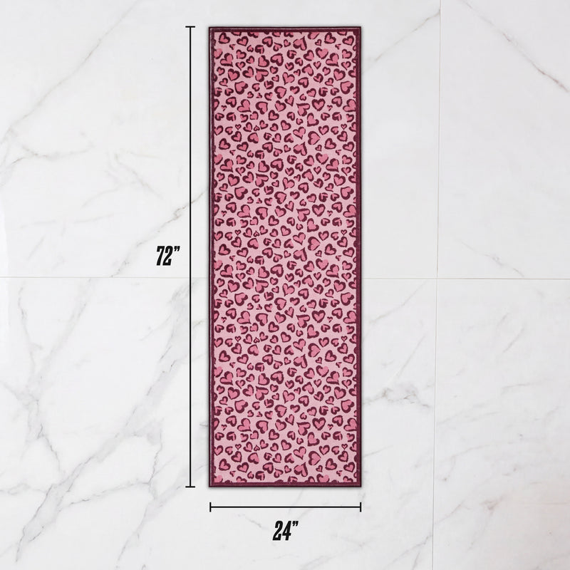 Finley Washable Rug, 2′ x 6′, an ultra-soft rectangular runner featuring a pink leopard heart print.