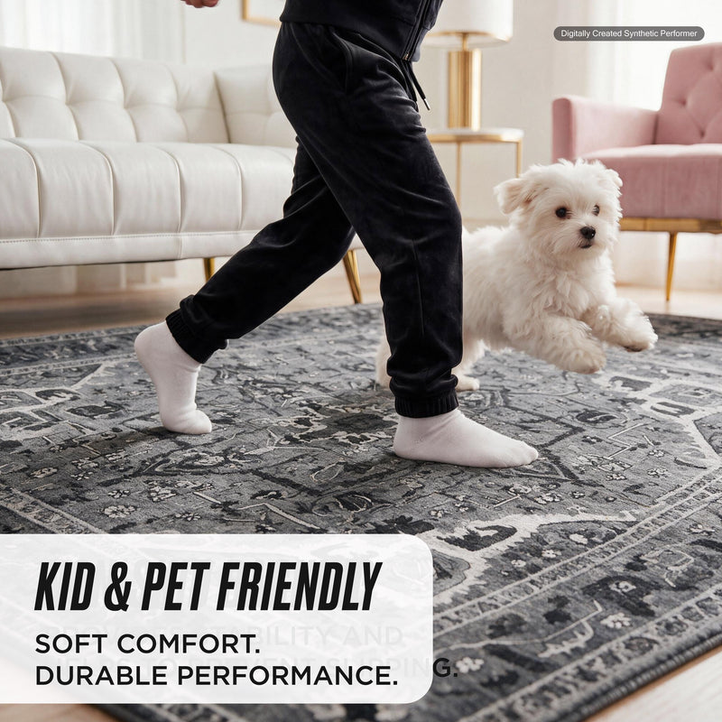 A person in black joggers and white socks walks on a grey and white distressed-style Finley Washable Rug, 2′ x 6′, while a small white dog runs beside them.