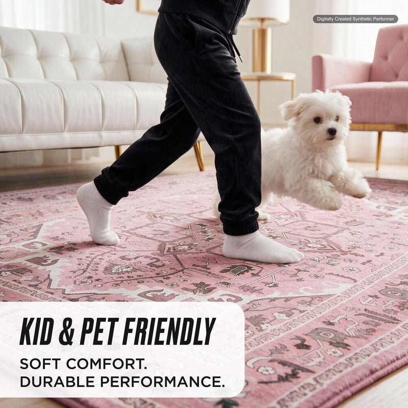 A person in black sweatpants and a small white dog walk across an ultra-soft, pink, patterned Finley Washable Rug, 8′ x 10′.