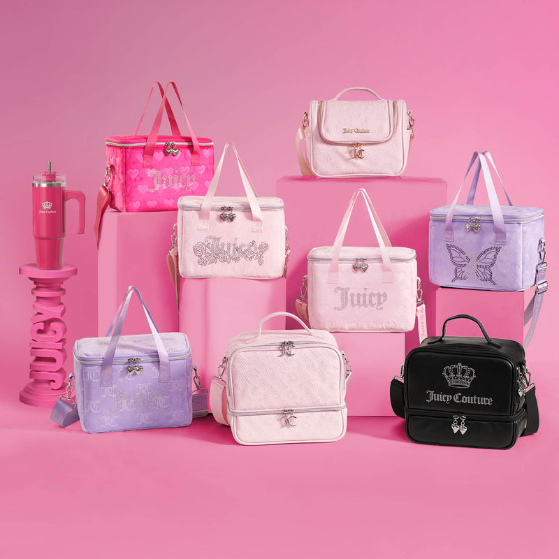 Seven pastel Double Zip Chill Cooler Bags and a pink Juicy Couture tumbler are arranged against a pink backdrop, with some bags displayed on pink platforms. The insulated cooler bags come in shades of pink, lavender, and black, each featuring unique decorative details.