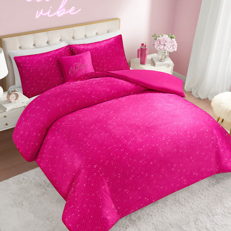 A stylish bedroom with light pink walls features the Velvet Rhinestone Princess Comforter Set—a plush, star-patterned bedding and pillow ensemble in bright pink velour—adorned on the bed. Flowers rest on the nightstand, and a neon sign above the headboard reads “love vibe.”.