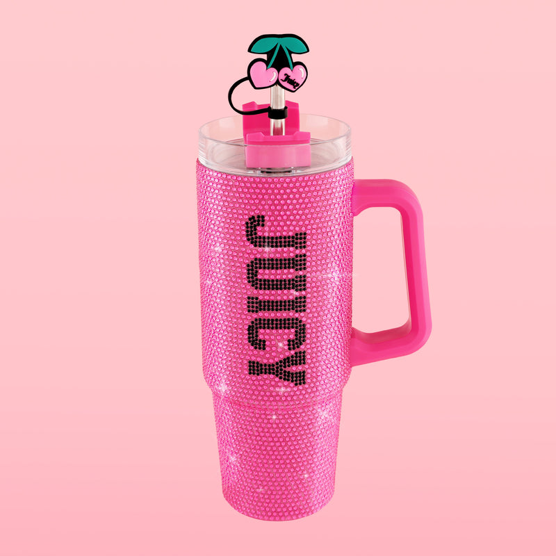 The BlingSip Rhinestone Tumbler with Handle Straw and Topper features a tall pink design encrusted with rhinestones, “JUICY” written vertically, a spacious handle, and a lid with a straw topped by a playful cherry cartoon decoration—all set against a light pink background—making this insulated stainless steel tumbler as stylish as it is functional.