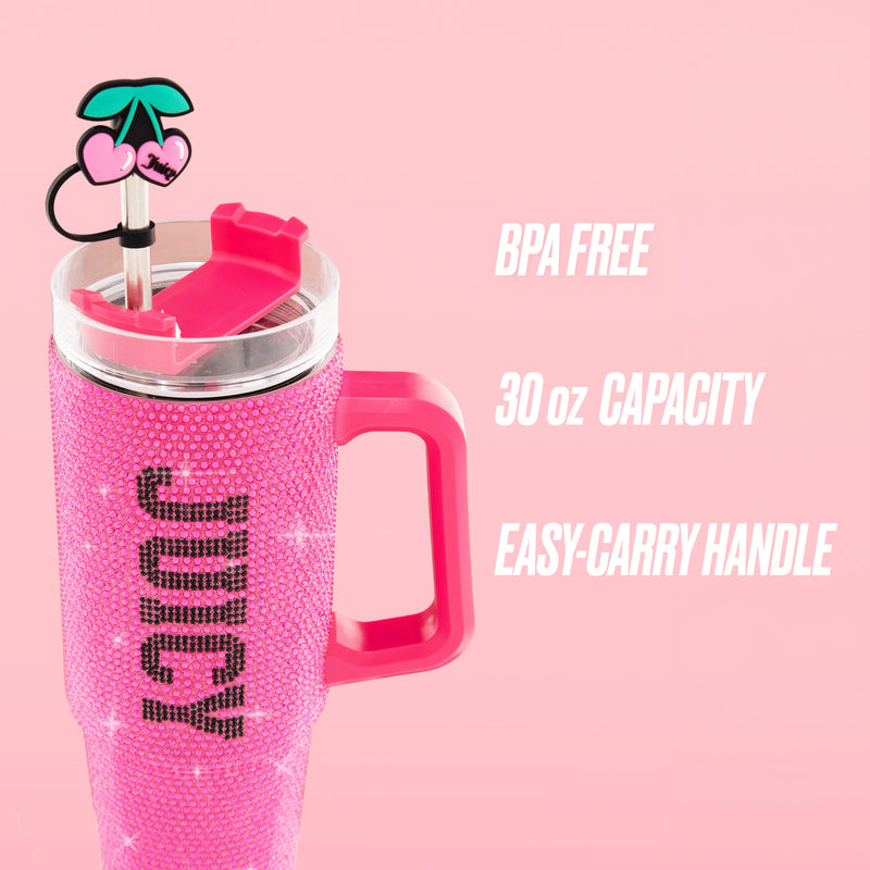 A BlingSip Rhinestone Tumbler with Handle, Straw, and Topper is showcased against a solid pink background. The insulated stainless steel tumbler features sparkling pink rhinestones and “JUICY” lettering, along with a cherry-designed straw topper. Text beside the product highlights: BPA FREE, 30 oz CAPACITY, EASY-CARRY HANDLE.