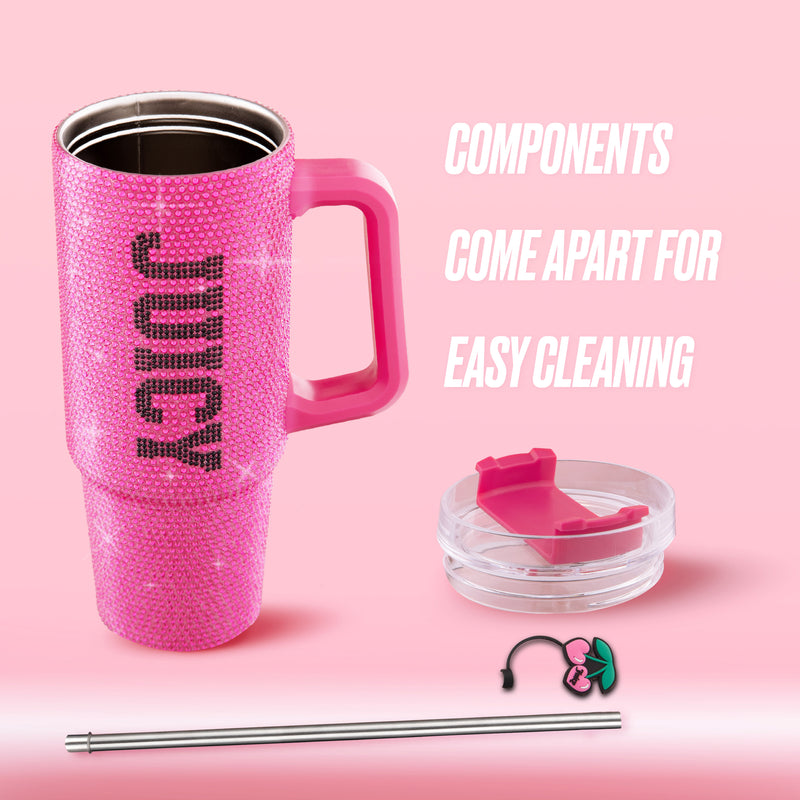 Introducing the BlingSip Rhinestone Tumbler with Handle, Straw, and Topper—a dazzling pink tumbler embellished with rhinestones and labeled “JUICY.” This insulated stainless steel tumbler keeps beverages at the ideal temperature and features a sturdy handle, removable lid, metal straw, and a convenient cleaning brush. All components detach easily for effortless cleaning. Shown against a pink background with text highlighting its easy-to-clean design, this glamorous Juicy Couture drinkware is both stylish
