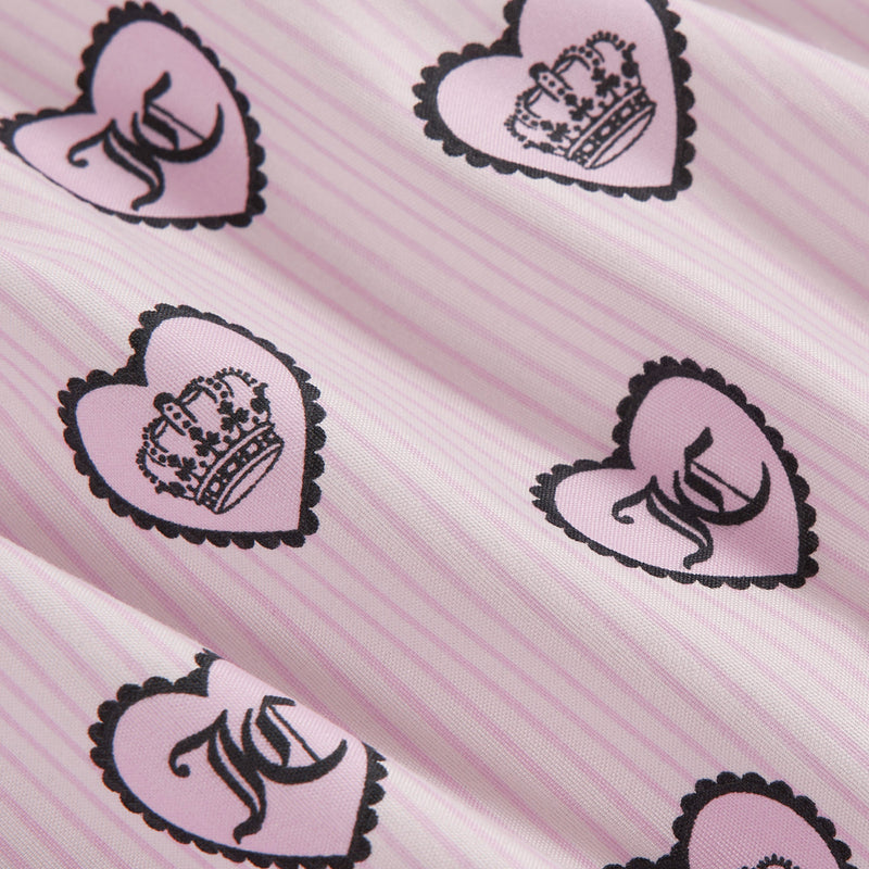 Featuring pink and white striped printed microfiber fabric adorned with pink heart shapes outlined in black—each heart showcasing either a black crown or a stylized black letter—this Printed Microfiber Sheet Set offers a cute, decorative pattern that’s perfect for adding a playful yet chic touch to your luxury bedding collection or as part of any stylish Juicy Couture-inspired set.