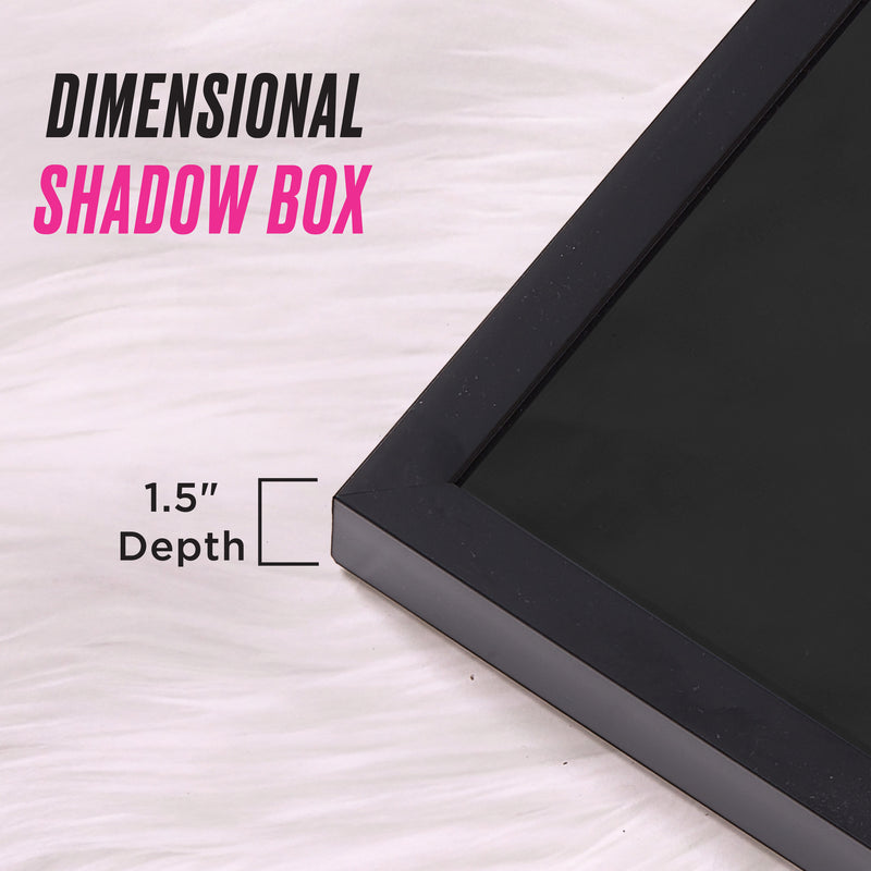 A black 18″ x 24″ Shadow Box Wall Art frame with a 1.5-inch depth rests on a white textured surface. Text reads “Shadow Box Wall Art” and “1.5 Depth,” with a line illustrating the frame’s thickness—ideal for showcasing fashion-inspired artwork or creating stunning shadow box art displays.