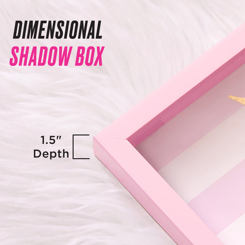 A close-up of the 12″ x 16″ Shadow Box Wall Art displayed on a white furry surface, with text that reads DIMENSIONAL SHADOW BOX and 1.5 Depth, highlighted by a bracket indicating the frame’s thickness—perfect for showcasing fashion-inspired artwork or Juicy Couture wall art in style.