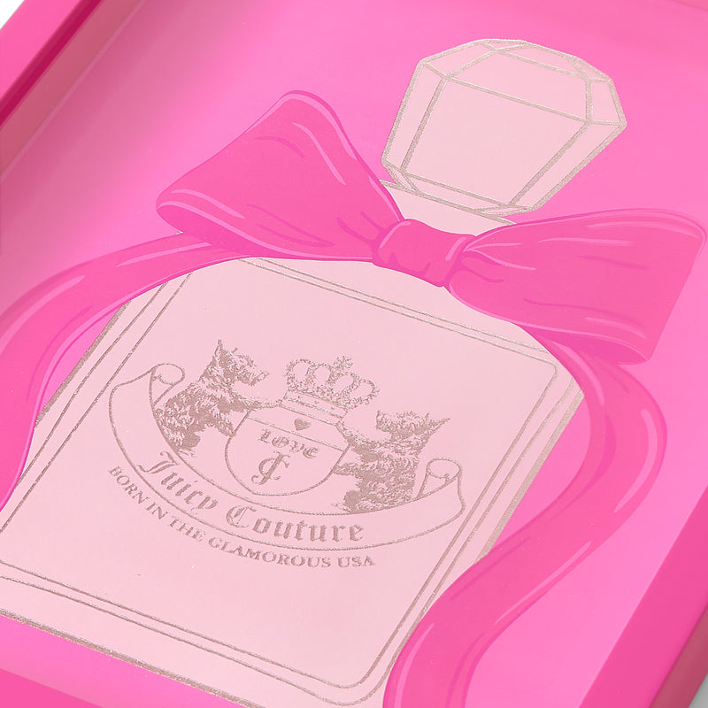A close-up of a pink Juicy Couture perfume bottle illustration, featuring a large bow and an ornate label with two lions and a crown—perfect as Shadow Box Wall Art, 12″ x 16″, to add a touch of glamour and fashion-inspired decor to any space.