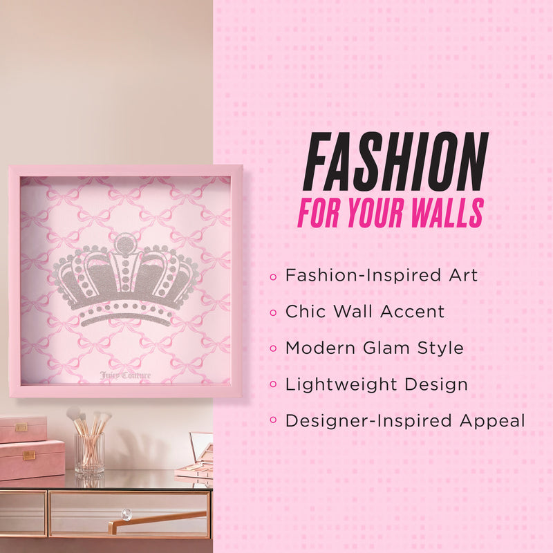A pink-framed Shadow Box Wall Art (14″ x 14″) with a jeweled crown design is displayed beside text listing its features: fashion-inspired artwork, chic wall accent, modern glam style, lightweight construction, and designer-inspired appeal. Ideal for fans of Juicy Couture wall art, this piece stands out above coordinating pink and gold decor beneath it.