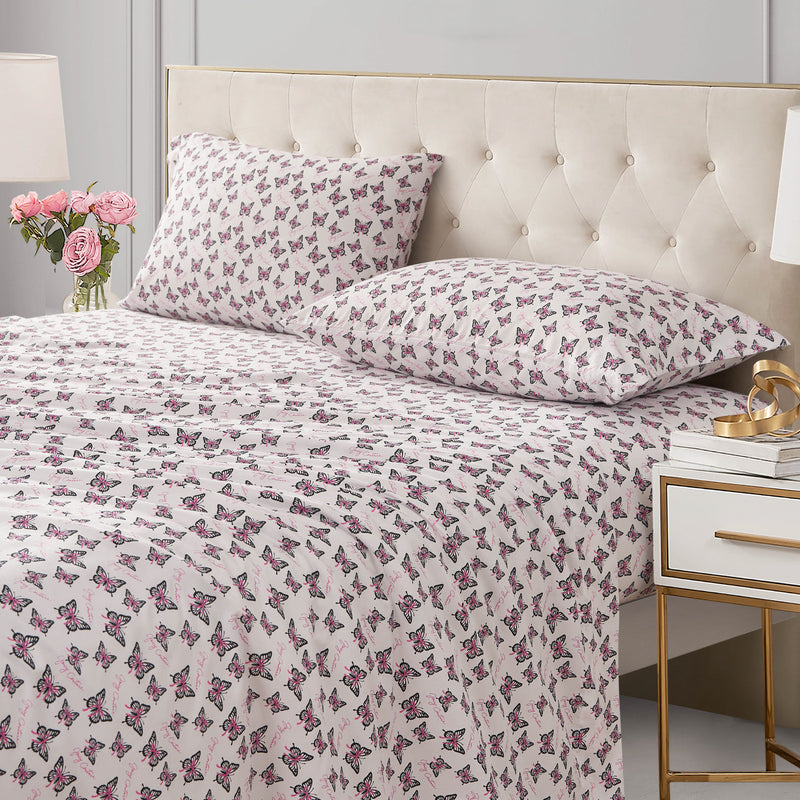 Printed Microfiber Sheet Set featuring bed sheets and two pillows patterned with black and pink butterflies on a white background.