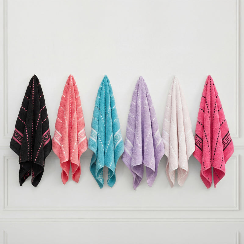 Six Plush Stripe Bath Towels—ultra-soft and quick-drying in black, coral, teal, lavender, white, and pink—hang evenly spaced in a row on hooks against a white wall.