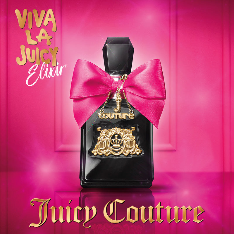 A black perfume bottle with a pink bow and gold charm stands against a pink background. Text reads Viva La Juicy Elixir Eau de Parfum Spray Pen, 0.33 fl oz by Juicy Couture in dazzling gold lettering for women.