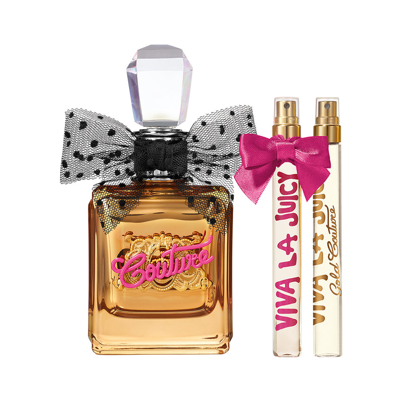Discover the Viva La Juicy Gold Couture 3 Piece Fragrance Gift Set—a chic women’s gift set featuring a perfume bottle adorned with a polka-dot bow labeled Couture, alongside two slim spray bottles of Juicy Couture perfumes: Viva La Juicy and Gold Couture, one elegantly finished with a pink ribbon.