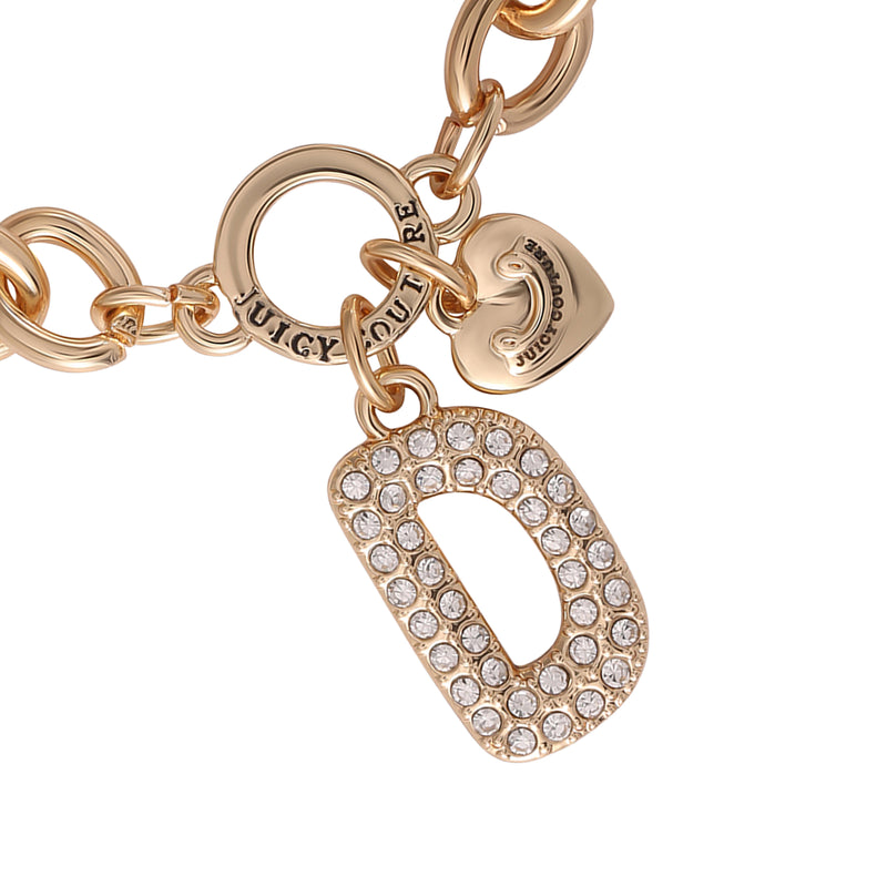 The Pavé Initial Charm Bracelet, Letter D features a gold chunky chain adorned with a round Juicy Couture charm, a small heart charm, and a large letter D pendant encrusted with rhinestones—an iconic addition to any charm jewelry collection.